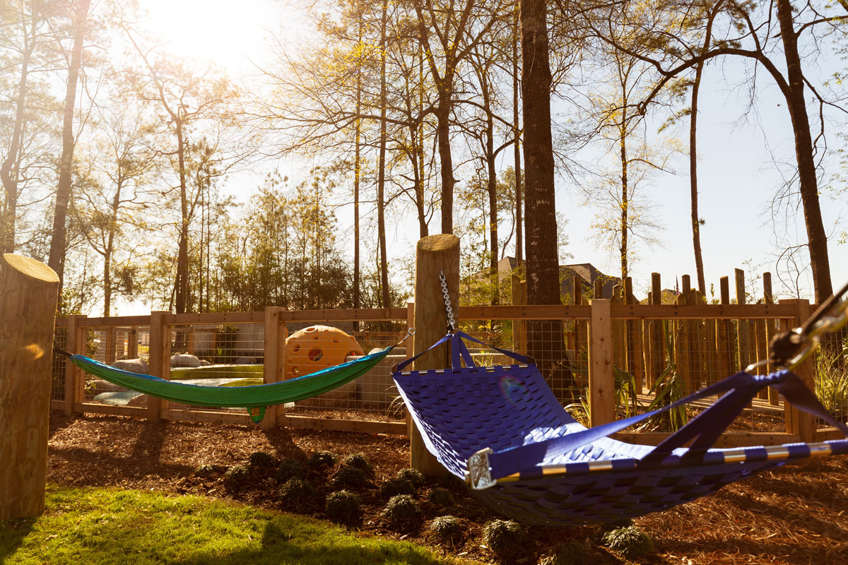 Mini hammocks help kiddos recharge before returning to the playscape. 