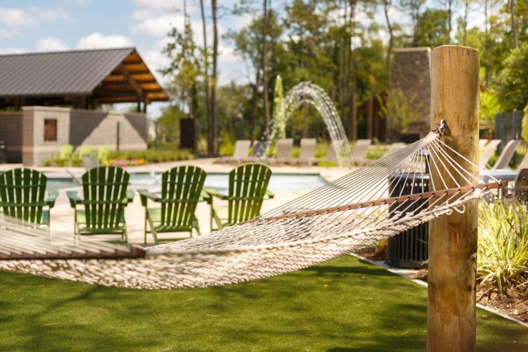 Relax in the hammocks by the resort-style pool located in The Hearth Amenity Center.