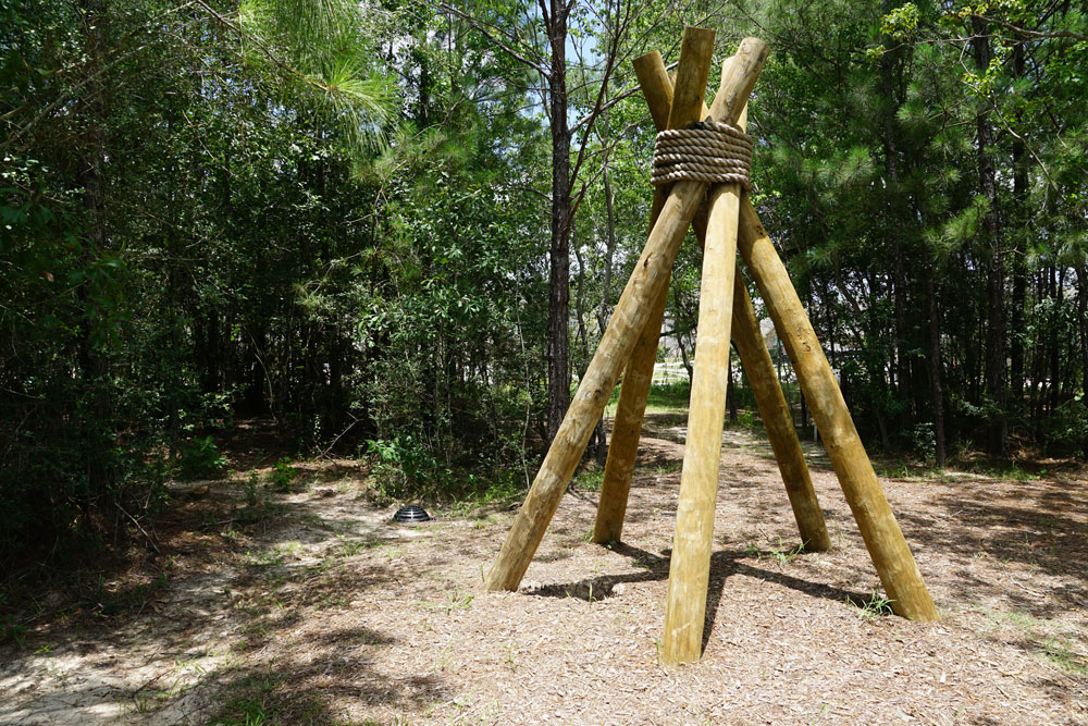 Kids can play under a teepee frame at Exploration Trails.